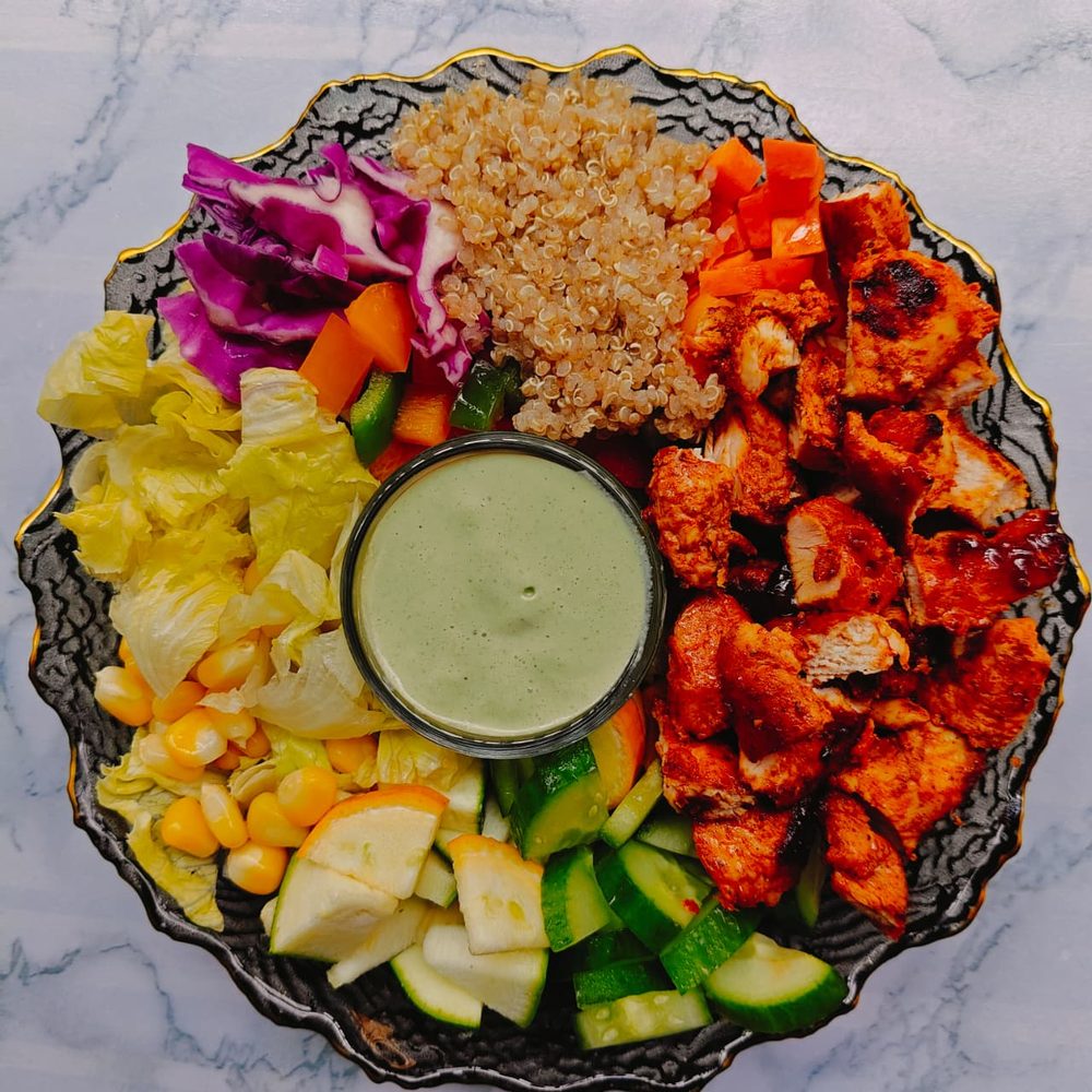 Herby Chicken Salad with quinoa, red cabbage, cucumber and a green dressing