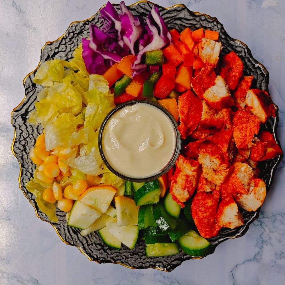 Peri Peri Chicken Salad with peppers, corn, cucumber and a creamy dressing